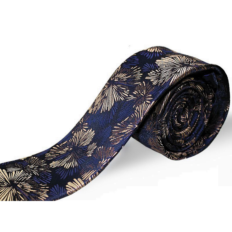 Béžová kravata vzorovaná na tmavomodrom podklade slim